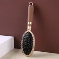 Professional champagne gold air cushion massage hairbrush with an ergonomic handle - Oval Cushion Brush
