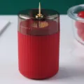 Automatic red toothpick dispenser with elegant vertical fluted design and gold trim - Red