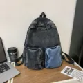 Modern charcoal grey denim backpack for women featuring a contrast blue front pocket - Letter F / Black
