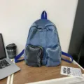 Fashionable blue denim backpack with unique grey pocket for travel and daily commute - Letter F / Blue