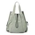 Fashionable light green nylon drawstring tote bag with versatile convertible shoulder straps - M / Pine Green