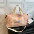 Pink quilted travel duffel bag with shoulder strap, stylish weekender fitness gym bag. - Pink