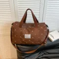 Brown quilted travel duffel bag with cute bow patterns, lightweight shoulder strap for sport. - Brown