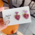 Detailed view of pink heart earrings featuring full rhinestone paving and purple enamel - Heart (E0083) / Purple