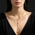 Elegant gold Y-shaped tassel necklace featuring colorful stones and a polished heart pendant - Heart and Colorful Rhinestone Style / Gold