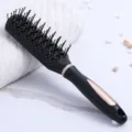 Black anti-static vented hairbrush with elegant gold accents for professional styling - Wavy Shape - Black