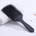Black anti-static paddle hairbrush with massage bristles on marble background - Large Square Black
