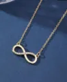 Minimalist infinity pendant necklace in a polished golden finish with crystals. - Gold