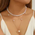Layered gold-tone chain necklace featuring Baroque pearls with starfish and shell charms - Starfish Shell Pearl Triple Necklace / Gold