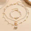 Elegant vintage baroque pearl necklace and bracelet set with shell starfish charms - Ocean Shell Starfish Pearl Necklace Bracelet Set / Gold
