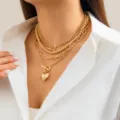 Layered gold necklace featuring bead and link chains with a heart pendant and toggle clasp - Four Layer Toggle Clasp Heart Necklace / Gold