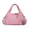 Lightweight pink water-repellent nylon handbag with practical multi-pocket travel design - Pink