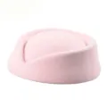 Detailed macro view of a vintage pink pillbox stewardess hat with soft wool texture - Pink