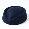 Side detail of a navy blue stewardess pillbox hat showing high-quality wool felt texture - Navy Blue