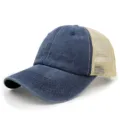 Detail view of the breathable mesh trucker hat, featuring washed blue cotton and durable mesh. - Adjustable / Navy Blue