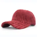 Detailed view of deep red thick corduroy texture on a curved brim baseball cap. - Adjustable / Burgundy