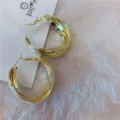 Detailed view of large multi-layered gold hoop earrings with a textured metallic finish - Multi-layer Circle Style (E0984) / Gold