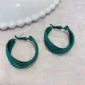 Close-up detail of dark green multi-layered hoop earrings with a chic matte finish - Multi-layer Circle Style (E0984) / Green