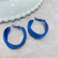 Close-up detail of matte blue multi-layer hoop earrings with textured background - Multi-layer Circle Style (E0984) / Blue