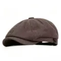 Detailed view of the herringbone wool texture on a classic retro newsboy cap - One Size / Coffee