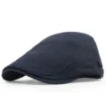 Classic navy blue cotton flat cap featuring vintage stitching details and a curved brim - Navy Blue
