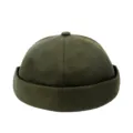 Primo piano del cappello docker verde militare realizzato con tela di alta qualità - Regolabile / Verde militare