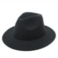 Close-up of a classic black felt fedora hat with a smooth finish and sturdy brim - One Size / Black