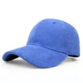 Close-up detail of a vibrant blue corduroy baseball cap featuring a classic curved brim. - Adjustable / Sapphire Blue