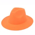 Detailed view of vibrant orange felt fedora hat featuring a classic jazz style crown - One Size / Orange-Yellow