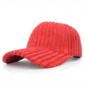 Detail view showing the thick ribbed corduroy texture of the red baseball cap. - Adjustable / Red