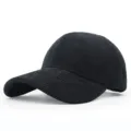 Detailed side view of a premium black corduroy baseball cap with a classic curved brim. - Adjustable / Black
