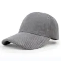 Detailed side view of a gray corduroy baseball cap with visible ribbed texture. - Adjustable / Gray