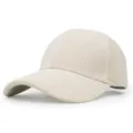 Detail view of a beige corduroy baseball cap with a classic curved brim. - Adjustable / Off White