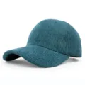 Detailed view of the teal blue corduroy texture on a curved brim baseball cap. - Adjustable / Dark Green
