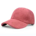 Detailed macro view of pink corduroy fabric on a classic curved brim baseball cap - Adjustable / Watermelon red