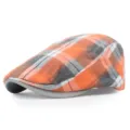 Vista laterale dettagliata di una elegante coppola retrò a scacchi arancione e grigio - M(56-58cm) / arancio-rosso