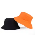 Wendbarer einfarbiger Fischerhut in Schwarz und Orange für Sonnenschutz im Freien - Einheitsgröße / Wendbar / Orange/Schwarz