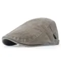 Detail view of vintage washed cotton flat cap in brown with adjustable side strap - Adjustable / Army Green