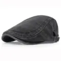 Macro view of vintage washed cotton flat cap with adjustable metal buckle detail - Adjustable / Black