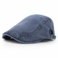 Side view of a vintage washed blue cotton newsboy cap with adjustable metal buckle - Adjustable / Navy Blue