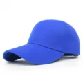Detail view of a plain blue baseball cap with a curved brim for sun protection. - 56-58cm (Adjustable) / Sapphire Blue
