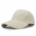 Detail view of the beige solid color baseball cap with curved brim and twill texture - 56-58cm (Adjustable) / Beige