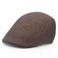Side view detail of a classic brown vintage men's beret cap with textured fabric - One Size / Coffee