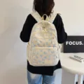Cream backpack with blue bow pattern for students, large capacity stylish design - Blue