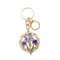 Llavero elegante de esmalte con flor de iris, metal dorado y brillantes - Forma de iris / Iris Calado