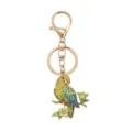 Colorful parrot keychain pendant with crystal wings on a gold-tone flowering branch accessory. - Green