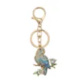 Exquisite parrot keychain featuring a blue enamel bird with sparkling rhinestones - Blue