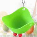 Bright green food-grade silicone egg poacher steamer bowl for microwave and stovetop use - Green