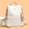 Fashionable white soft leather women's backpack with pink accents and elegant tassel - L / White & Pink