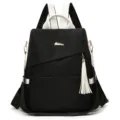 Modern black and white anti-theft backpack with stylish white tassel charm for women - L / Black and White